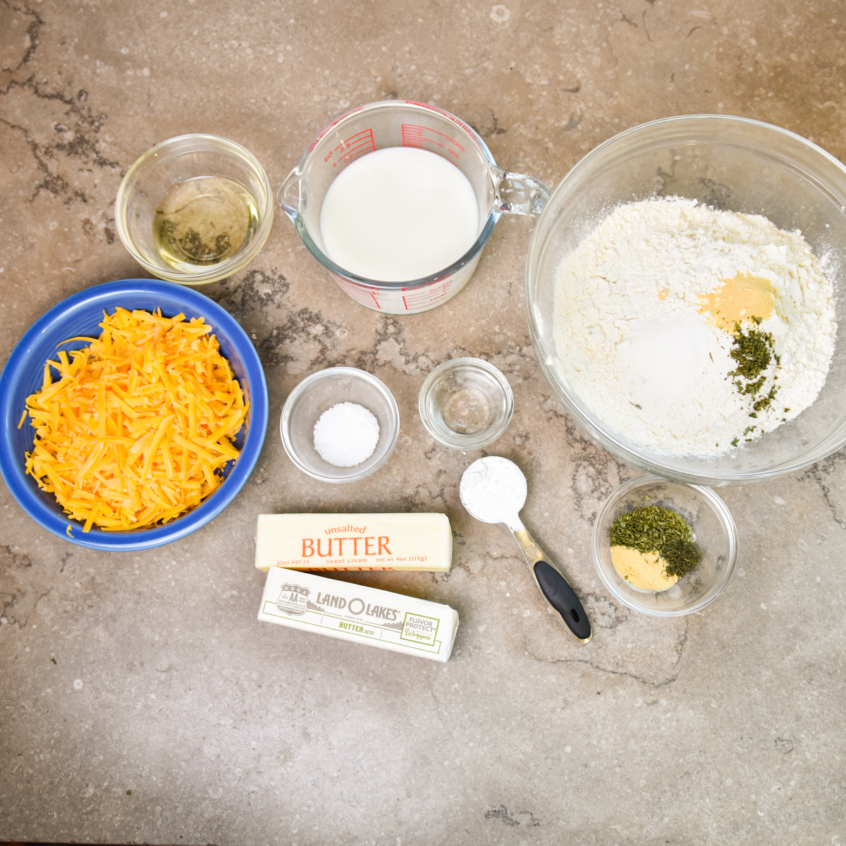Ingredients for homemade cheddar bay biscuits in a skillet.