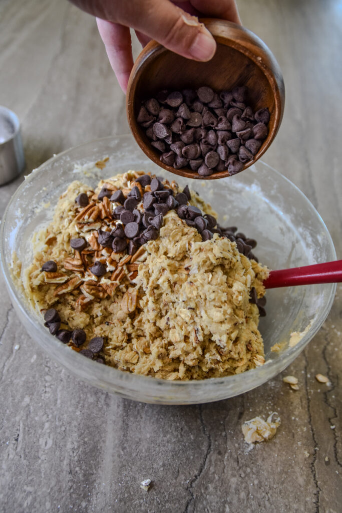 Adding chocolate and pecans to Oaties.