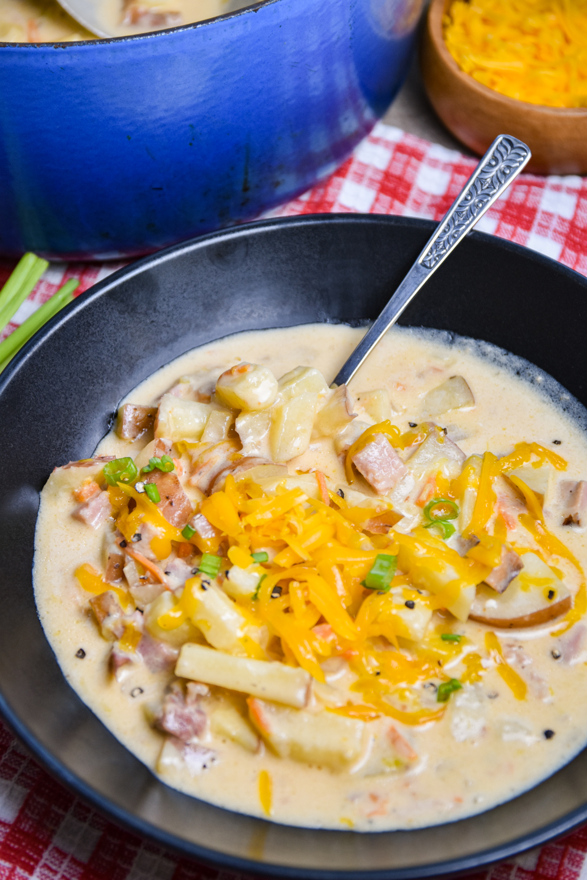 Bowl of potato soup with ham.