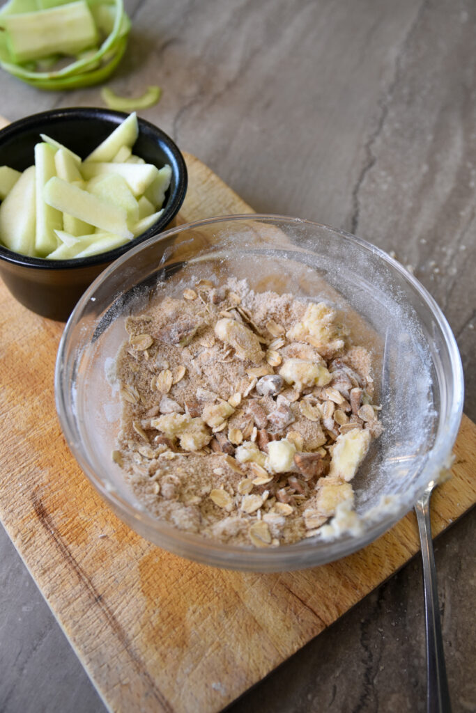 Bowl of crumble ready to be put on Single Serving Apple Crumble