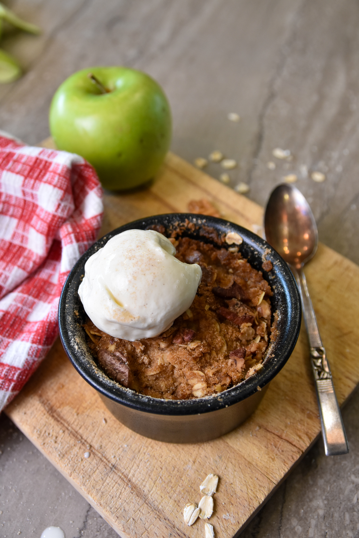 Single Serving Apple Crumble with ice cream in a bowl.