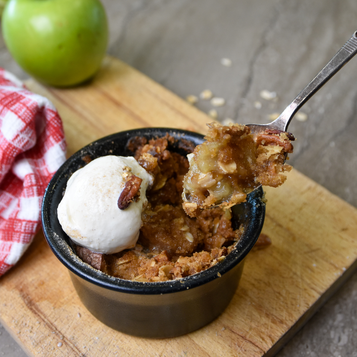 Bite of warm single serving apple crisp Bite of Single Serving Apple Crumble