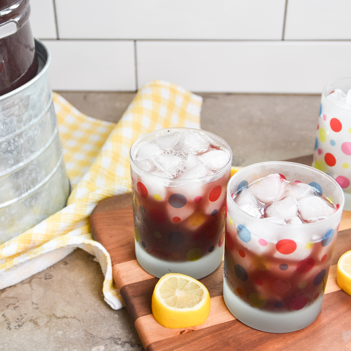 Glasses and dispenser of purple party punch