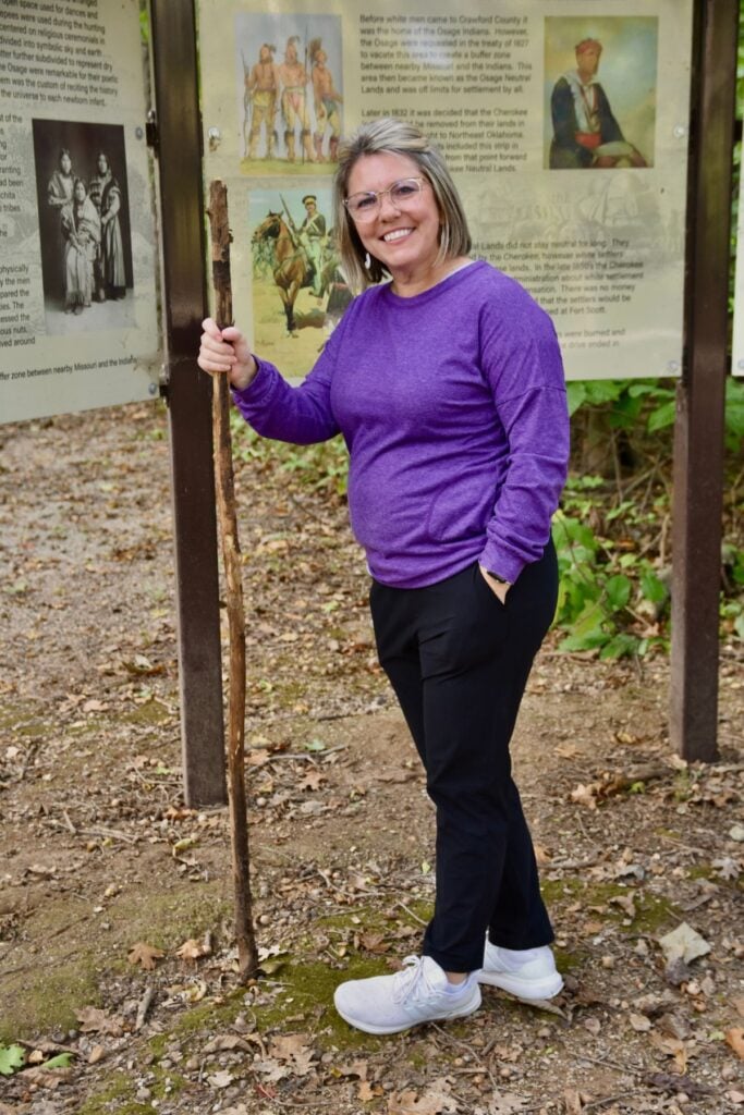 Getting ready to walk a trail and reading the history of the trail.